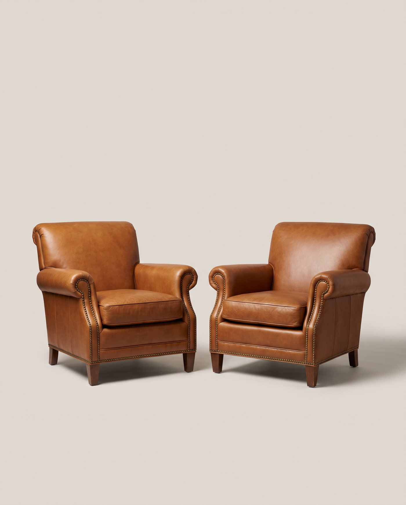 Whitmore Leather Club Chairs - front three-quarter hero shot